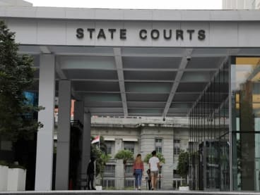 Construction worker jailed 1 week for peeping at woman in toilet cubicle; claimed he was throwing rubbish