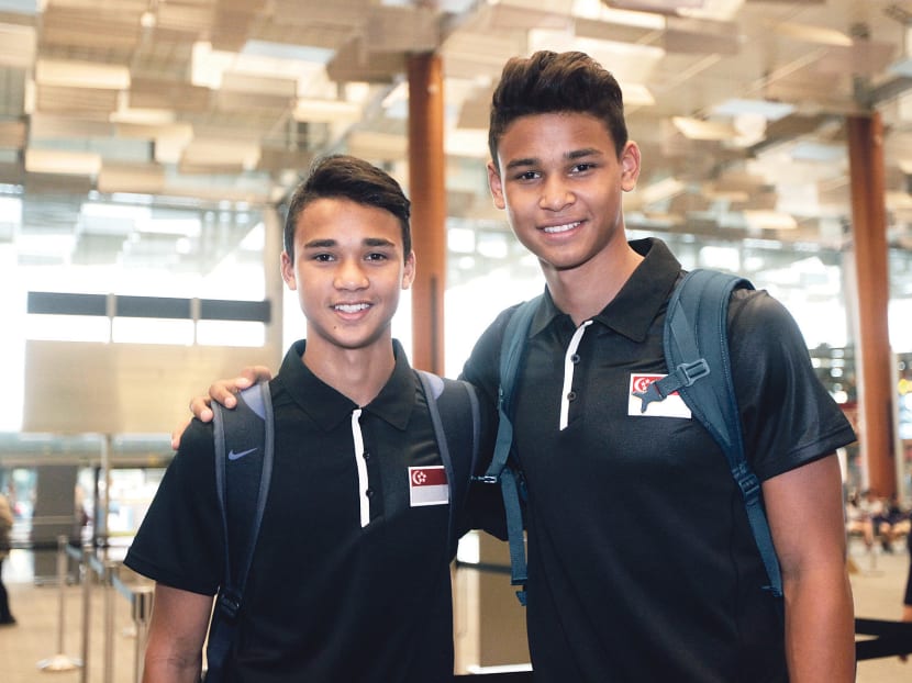 Ikhsan (left, with brother Irfan) says training at Catolica is far more intense, but he feels his skills and approach to the game have improved tremendously.  
Photo: Wee Teck Hian