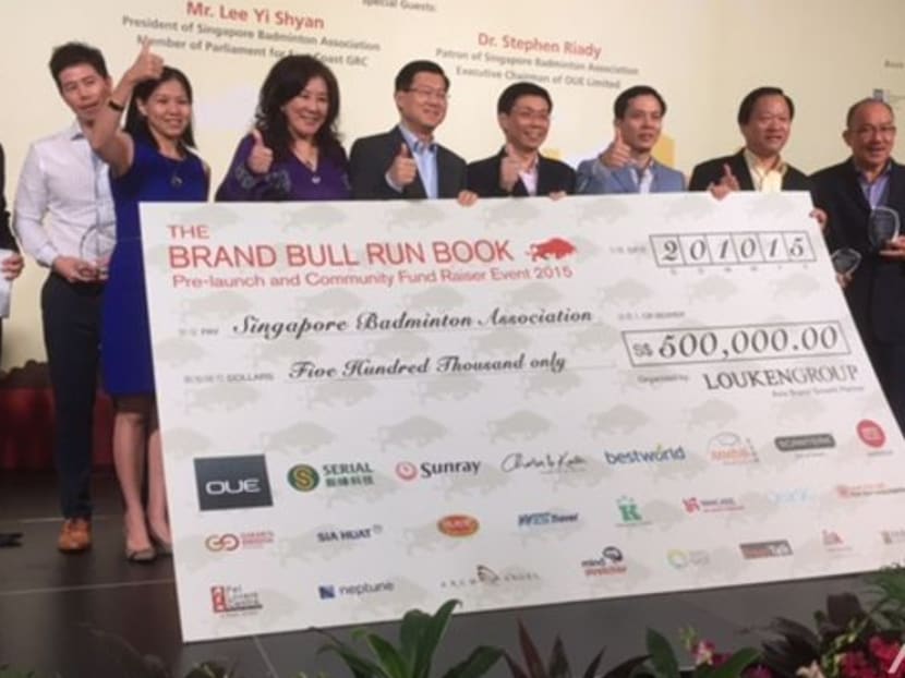 Singapore Badminton Association receives cheque of S$500,000 during Louken Group's Community Fund Raiser. Photo: Olivia Qua/Channel NewsAsia