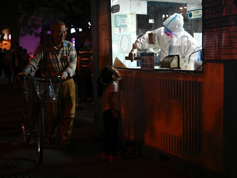 A health worker gets a swab sample from a child to be tested for Covid-19 coronavirus at a nucleic acid testing station in Beijing on Sept 24, 2022.
A health worker gets a swab sample from a child to be tested for Covid-19 coronavirus at a nucleic acid testing station in Beijing on Sept 24, 2022.