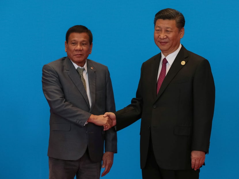 Chinese President Xi Jinping shaking hands with Philippine President Rodrigo Duterte at Yanqi Lake during the Belt and Road Forum, in Beijing, China on May 15, 2017. Photo: Reuters