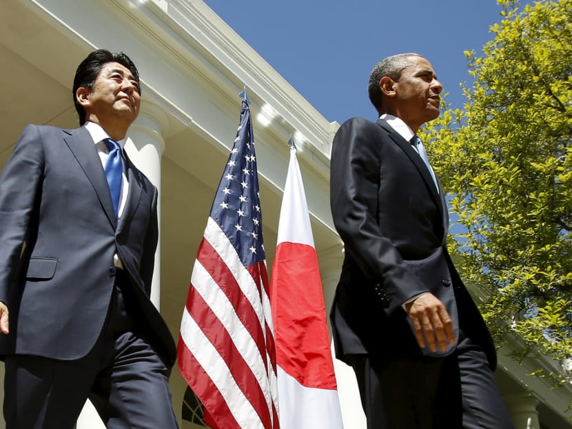 US President Barack Obama and Japanese Prime Minister Shinzo Abe arrive for a joint news conference in the Rose Garden of the White House in Washington on April 28, 2015. Reuters file photo