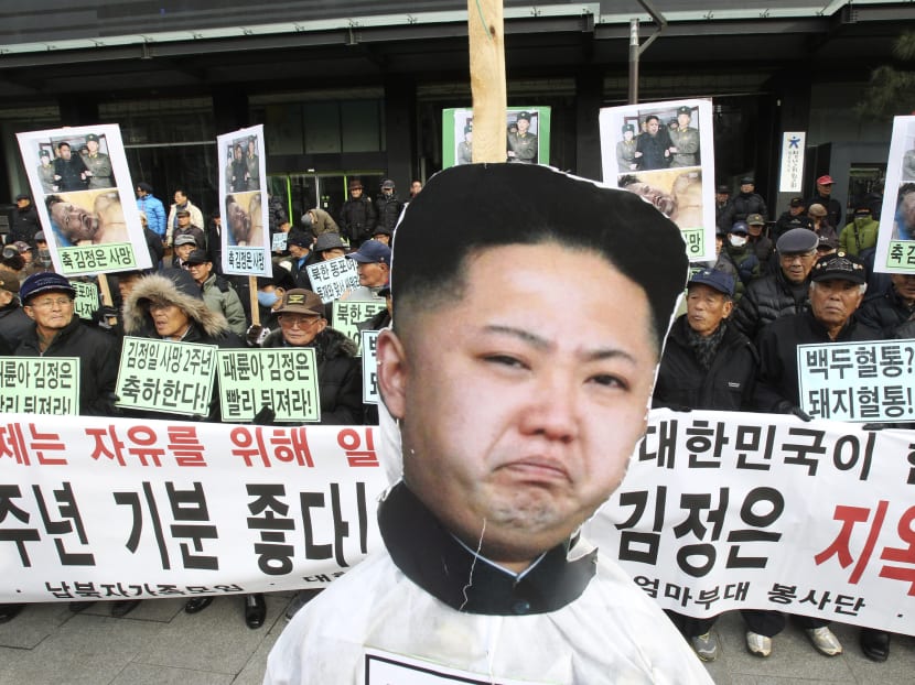 A portrait of North Korean leader Kim Jong Un is displayed during an anti-North Korea rally marking the second year anniversary of former North Korean leader Kim Jong Il's death in Seoul, South Korea, Tuesday, Dec 17, 2013.  Photo: AP