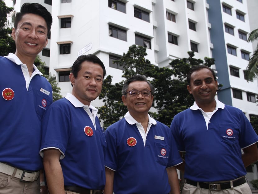 The Singaporeans First party's Mr Melvyn Chiu, Mr Fahmi Rais, Mr Tan Jee Say and Mr Chirag Desai posing for a shot before a walkabout at Dawson place. Photo: Daryl Kang