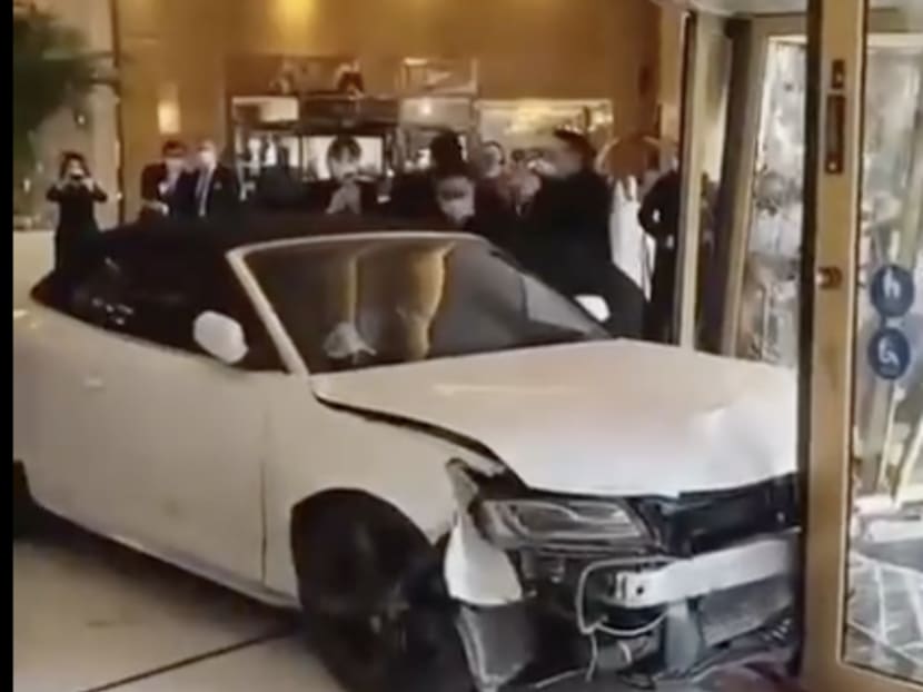 Several videos published on social media showed the white car smashing the glass doors of the central Shanghai hotel from their hinges, reversing and then bursting through into the lobby, knocking over anything in its path.