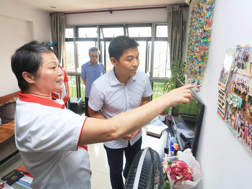 Rhythmic gymnastics coach Zhu Xiaoping, who is recognised for her selfless dedication to help her athletes prepare for the 28th SEA Games despite a battle with stage 4 cancer, seen having a talk with Minister for Social and Family Development Mr Tan Chuan-Jin during his visit on June 17, 2016. Photo: Koh Mui Fong/TODAY