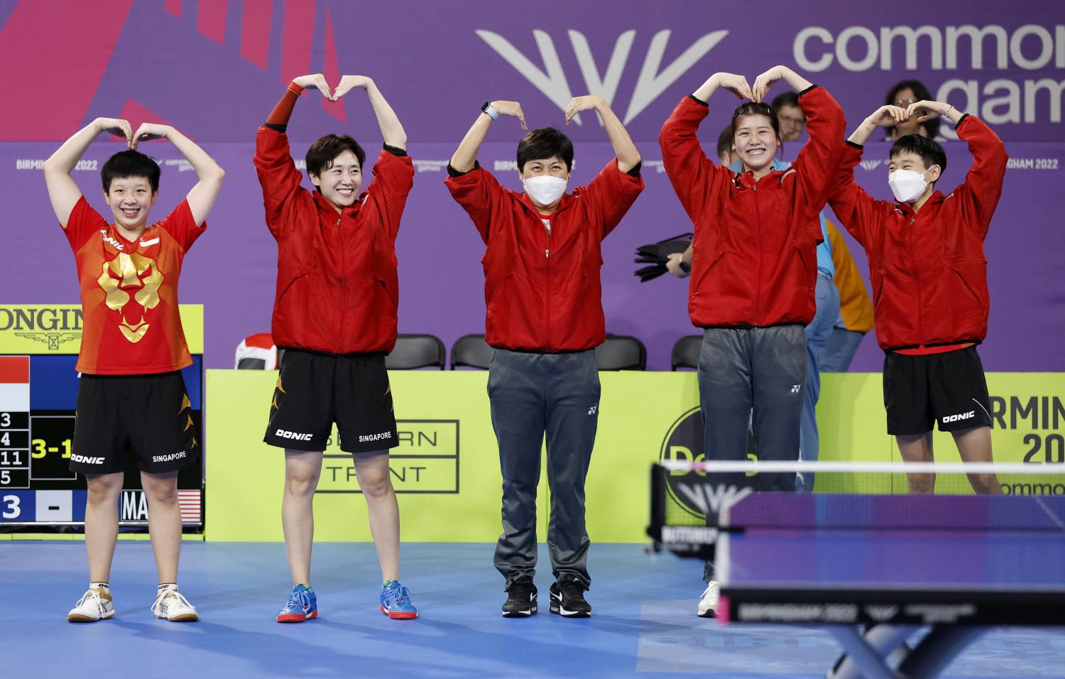 Singapore’s table tennis team celebrate after winning team gold at the Commonwealth Games on Aug 1, 2022. 