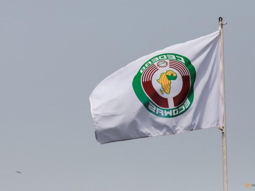 Economic Community of West African States (ECOWAS) flag is pictured during an extraordinary summit of ECOWAS to hear reports from recent missions to Mali, Burkina Faso and Guinea following military coups in those countries, in Accra, Ghana March 25, 2022. REUTERS/Francis Kokoroko/File Photo Economic Community of West African States (ECOWAS) flag is pictured during an extraordinary summit of ECOWAS to hear reports from recent missions to Mali, Burkina Faso and Guinea following military coups in those countries, in Accra, Ghana March 25, 2022. REUTERS/Francis Kokoroko/File Photo