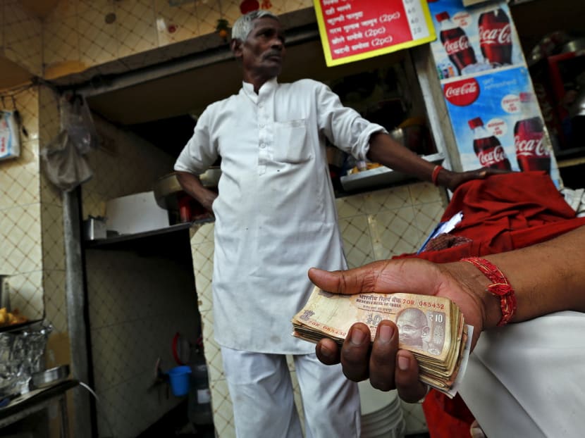 Demonetisation, which invalidated most circulating cash overnight, and the move to a new value-added tax system have been crushing to informal cash-based businesses in India. Photo: Reuters