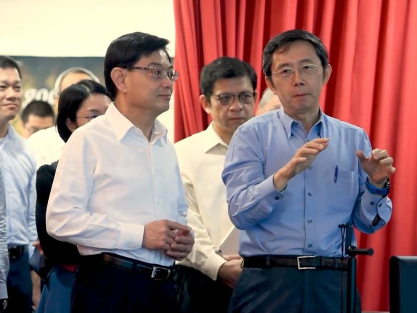 Sim Wong Hoo (right) with Deputy Prime Minister Heng Swee Keat (left) at a demonstration of Creative Technology's Super X-Fi technology in 2019.