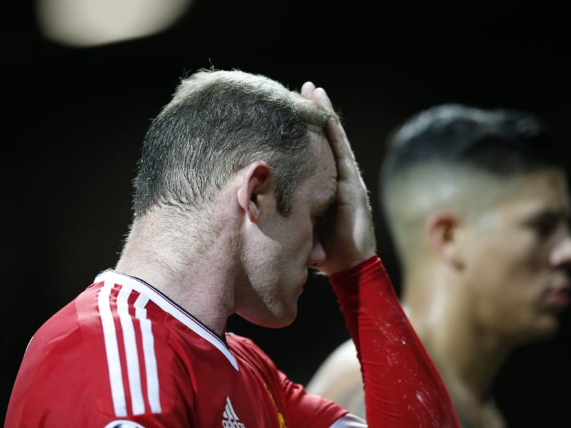 Manchester United's Wayne Rooney reacts after the Champions League group B soccer match between Manchester United and PSV Eindhoven at Old Trafford Stadium. Photo: AP