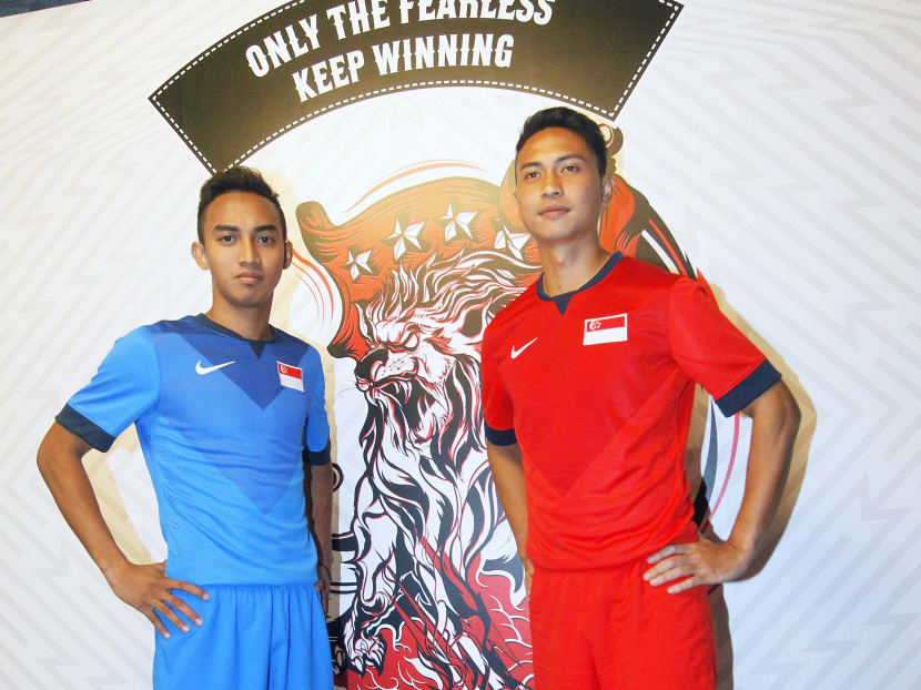 Lions Shahril Ishak (right) and Faris Ramli  showing off the new national team kit, which will debut at the Suzuki Cup later this month. Photo. Ernest Chua