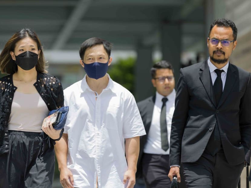 Karl Liew (second from left) seen at State Courts on March 30, 2023. 
