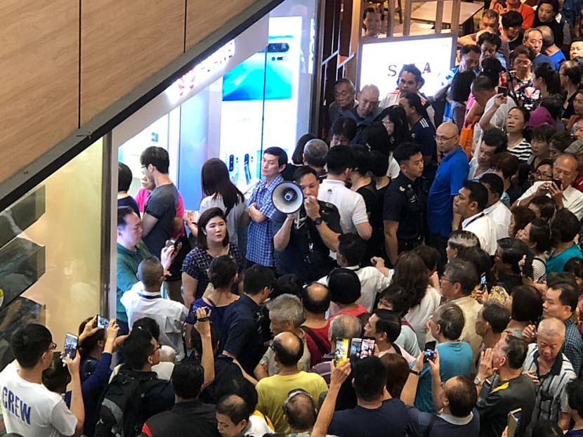 A crowd formed outside the Huawei Concept Store at Northpoint City in Yishun on the  morning of July 26, 2019, for the discounted Y6 Pro 2019 mobile phones.