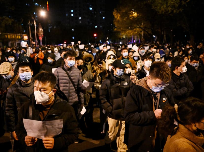 Protesters march along a street during a rally for the victims of a deadly fire as well as a protest against China's harsh Covid-19 restrictions in Beijing on Nov 28, 2022. Protesters march along a street during a rally for the victims of a deadly fire as well as a protest against China's harsh Covid-19 restrictions in Beijing on Nov 28, 2022.