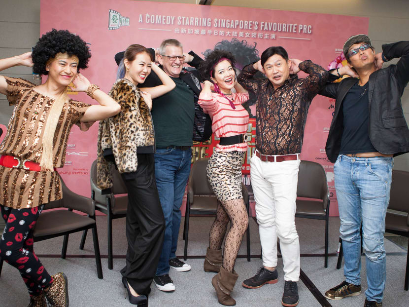 The cast from Lulu The Movie, together with host Pornsak (left), strike Lulu's trademark pose during a press conference on Monday (Oct 21). Photo: Chua Hong Yin