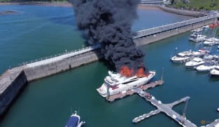 Fire engulfs superyacht in British marina