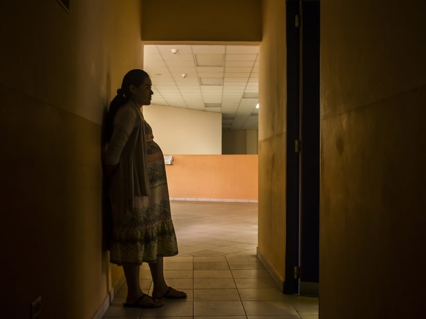 Carmen Cruz, 31, waits to have her prenatal exam at the National Hospital for Women in San Salvador, El Salvador. Latin American governments are preparing as Zika, mosquito-borne illness, spreads through the continent. In the Central American nation authorities have urged women to put off pregnancy for two years. Photo: AP