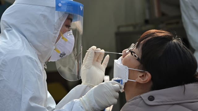 韩国新增8万多起冠病病例