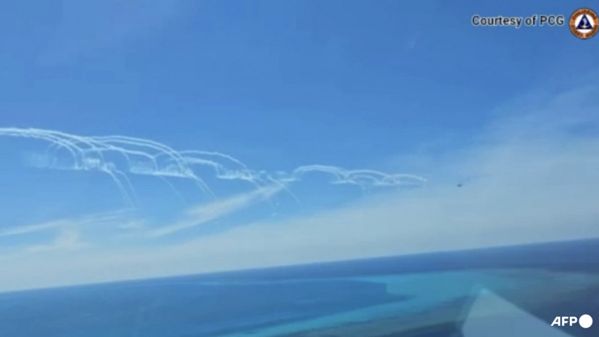 Philippines says China fired flares at its South China Sea plane Philippines says China fired flares at its South China Sea plane