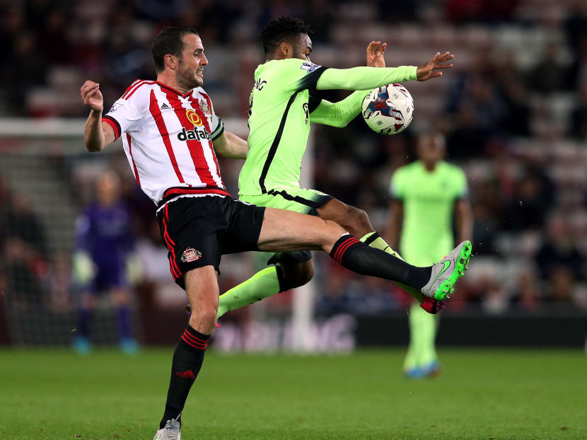 Sunderland's captain John O'Shea, left, vies for the ball with Manchester City's Raheem Sterling, right, during the English League Cup third round soccer match between Sunderland and Manchester City at the Stadium of Light, Sunderland, England, Tuesday, Sept. 22, 2015. Photo: AP