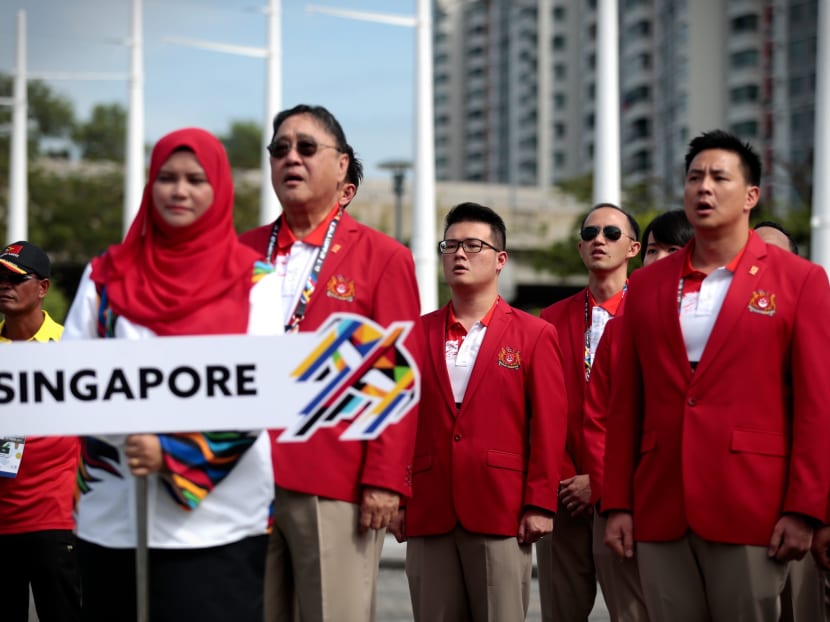 Singapore's chef de mission Milan Kwee (in sunglasses) wants Singapore's athletes to win as many gold medals as possible. Photo: Jason Quah/ TODAY