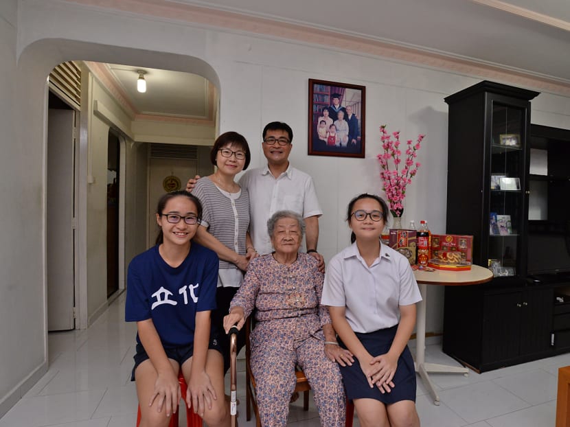 Mr Tan Chow Hua (top right) with his family. Photo: Robin Choo/TODAY