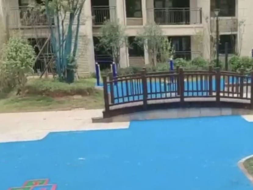 An outdoor area is covered in plastic to suggest a lake at a property development in Changsha, Hunan province. An outdoor area is covered in plastic to suggest a lake at a property development in Changsha, Hunan province.