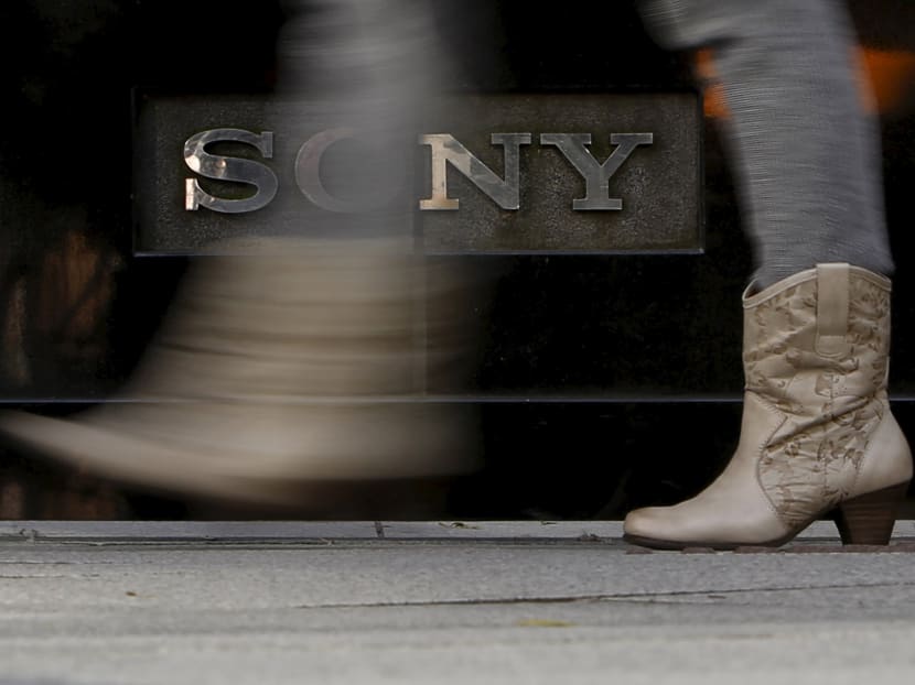 A woman walks past a logo of Sony Corp outside its showroom in Tokyo, Japan, Jan 27, 2016. Photo: Reuters