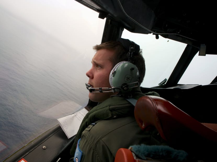 Flying Officer Marc Smith, turns his Royal Australian Air Force (RAAF) AP-3C Orion aircraft at low level in bad weather while searching for the missing Malaysian Airlines Flight MH370 over the southern Indian Ocean. Photo: Reuters