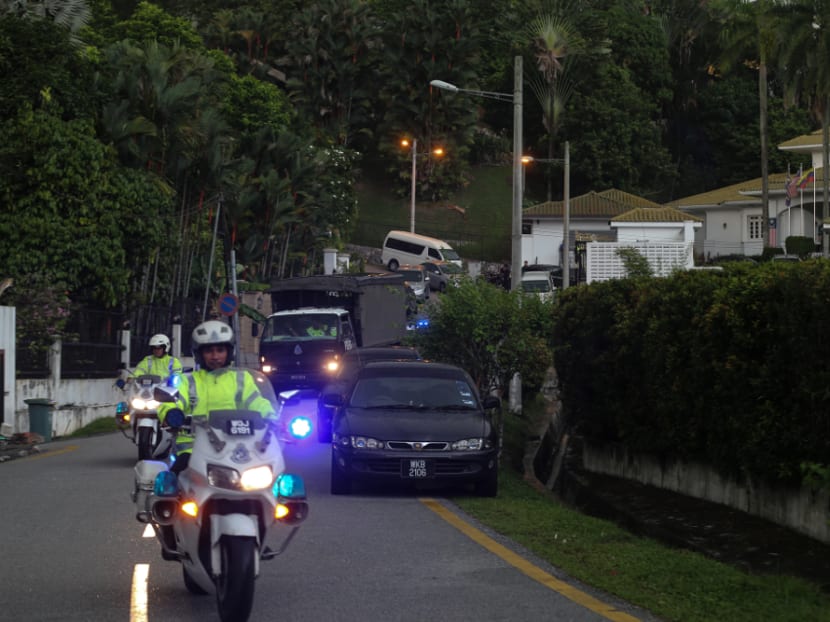 Police trucks are seen leaving Datuk Seri Najib Razak’s house carrying boxes believed to be personal belongings related to an ongoing money laundering probe on May 17.
