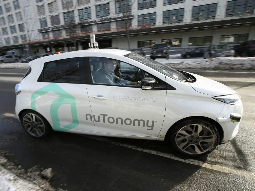 An autonomous vehicle is driven by an engineer on a street through an industrial park, in Boston, Jan 10, 2017. Photo: AP
