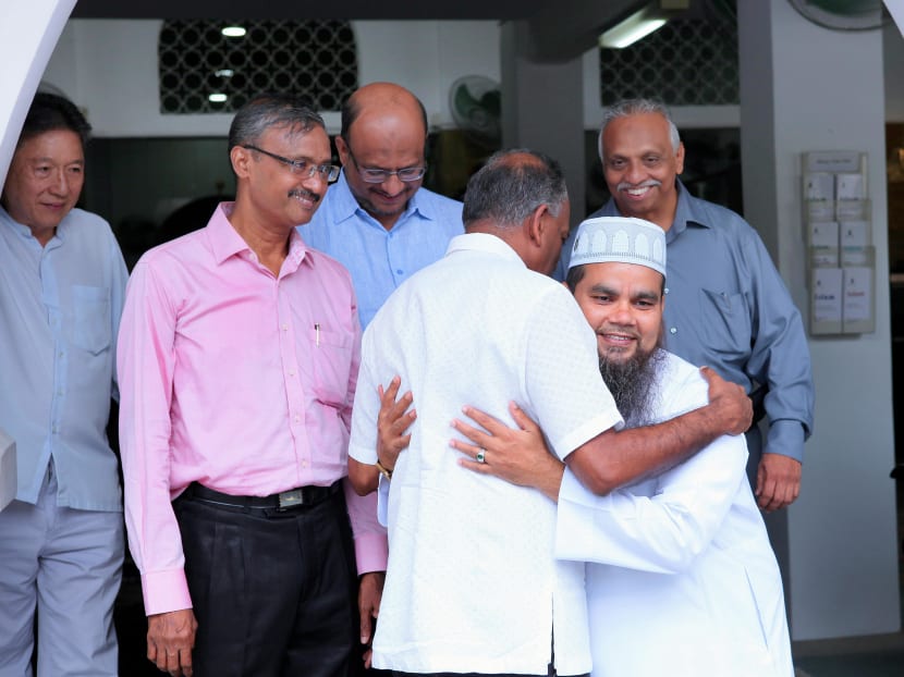 Law and Home Affairs Minister K Shanmugam sharing a hug with Iman Nalla on Wednesday morning. Photo: Ba’alwie Mosque