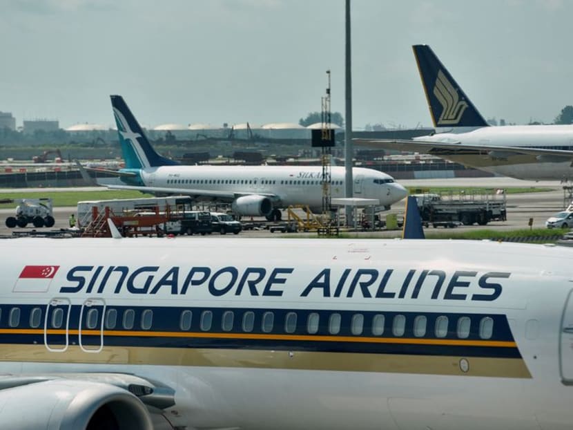 FILE PHOTO: Singapore Airlines planes sit on the tarmac at Changi Airport in Singapore November 16, 2021. REUTERS/Caroline Chia/File Photo