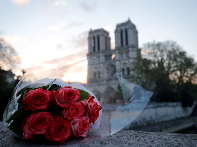 Photo of the day: A bunch of roses placed near Notre-Dame Cathedral is pictured at sunrise after a massive fire devastated large parts of the gothic structure in Paris, France, on Wednesday, April 17, 2019.
