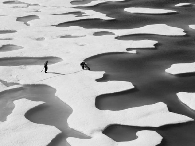 Crew members of an icebreaker in the Arctic Ocean. Singapore and other parts of the world are quite closely connected to the Arctic because of climate change, global warming and weather patterns. Photo: Reuters/Nasa