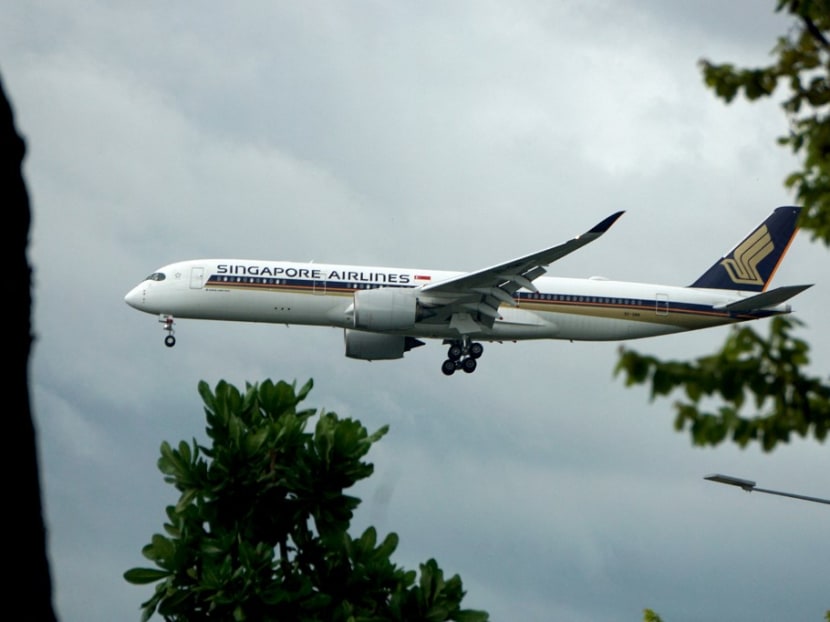 A Singapore Airlines plane prepares to land at Changi International airport in Singapore on Aug 14, 2021.
