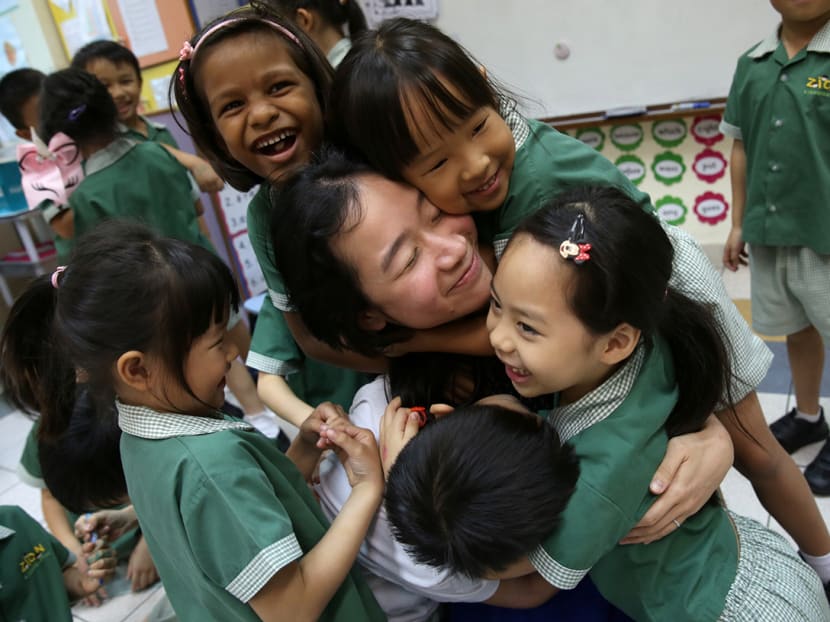 Zion kindergarten principal Hannah Ong with children from a K2 class.