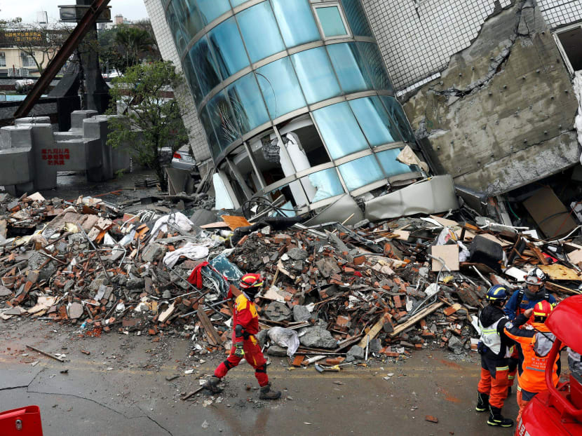 A rescuer walks outside a collapsed building after an earthquake hit Hualien, Taiwan. The self-ruled island Taiwan has turned down an offer from Beijing to send a rescue team to help with search and rescue work. Photo: Reuters