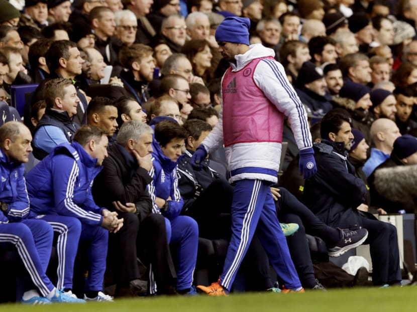 Chelsea’s Diego Costa returning to the bench after warming up during the English Premier League match between Tottenham Hotspur and Chelsea at White Hart Lane in London yesterday. Photo: AP