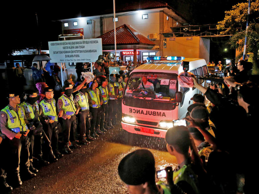 An ambulance carrying the body of an executed prisoner leaving Nusakambangan last month. Researchers have found that many condemned convicts were tortured by the police into confessing. Photo: Reuters
