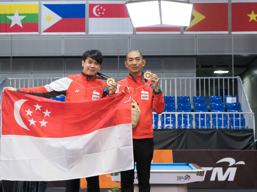 Chan Keng Kwang and Tey Choon Kiat celebrate their gold medal. Photo: Flona Hakim/Sport Singapore