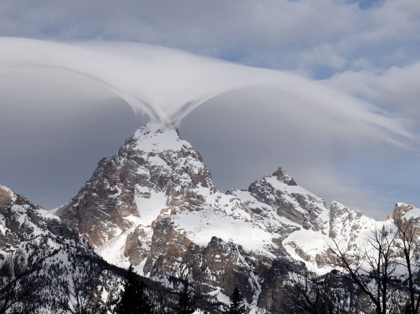 This photo taken on Feb 12, 2015, and provided by the Grand Teton National Park shows, an unusual cloud formation across the summit of the Grand Teton in this view from the park's headquarters campus. Photo: AP