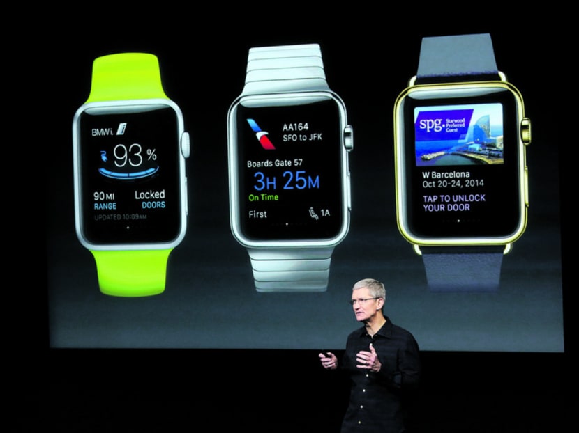 Apple CEO Tim Cook in front of a screen displaying apps available for the Apple Watch at Apple's headquarters last year. Photo: REUTERS