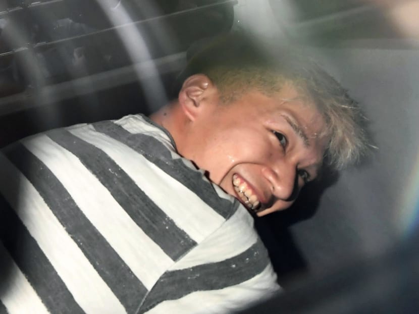 Satoshi Uematsu, the suspect of Tuesday's knife attack at a home for the mentally disabled, sits inside a police van as he leaves a police station in Sagamihara, outside Tokyo to be sent to prosecutors Wednesday, July 27, 2016. Photo: Kyodo News via AP
