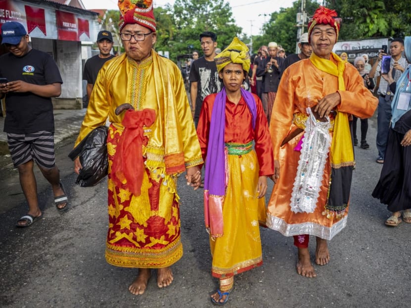 The Bissu, non-binary priests, taking part in a Mappalili ceremony in Pangkajene, South Sulawesi on Nov 16, 2022.