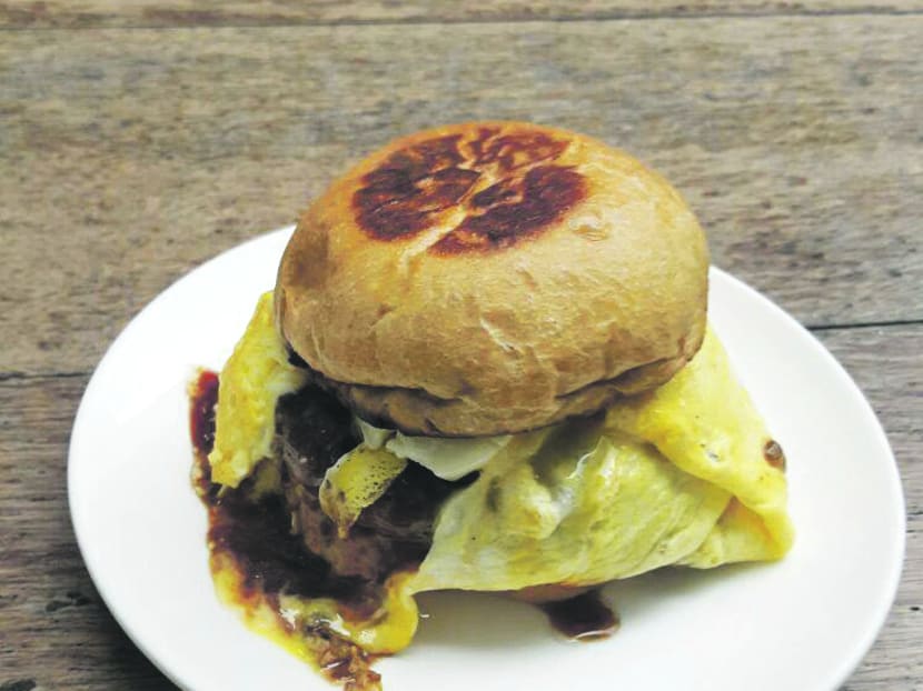 Chow down on the Singapasar Burger from Tanuki Raw
