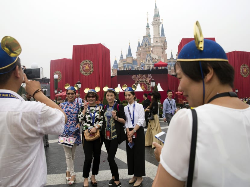 Guests attend an opening ceremony for the Disney Resort in Shanghai, China, Thursday, June 16, 2016. Photo: AP