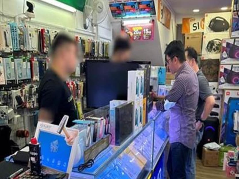 A photograph supplied by the Singapore Police Force in relation to raids carried out at eight hand phone shops across Singapore on March 30 and 31, 2023.
