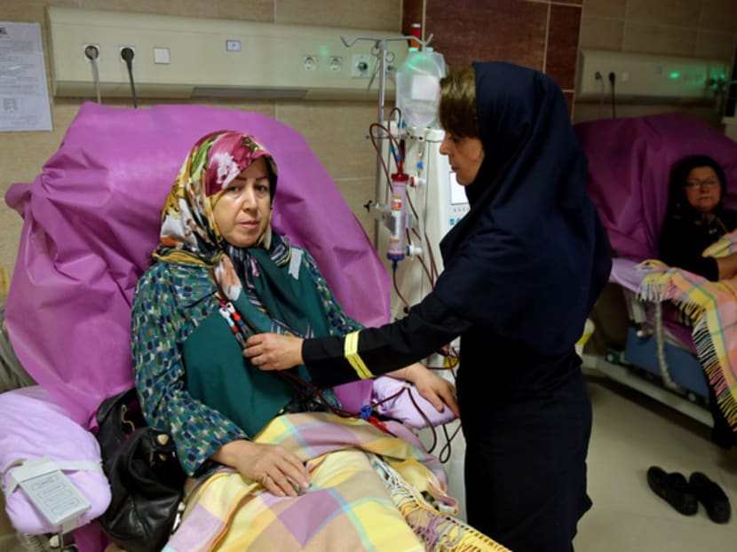 Mrs Zahra Hajikarimi (left) has to spend hours travelling for her dialysis treatment. Photo: AP